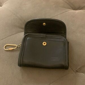 Small Navy Coach change purse.   Used.  Excellent condition.